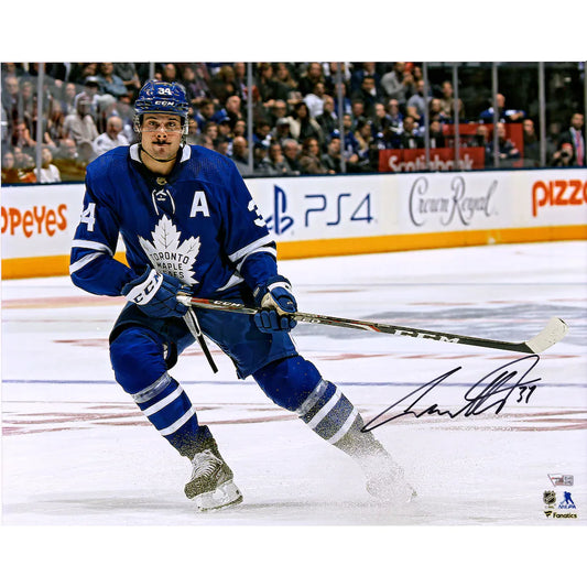 Auston Matthews - Toronto Maple Leafs Autographed 16" x 20" Blue Jersey Stopping Photograph